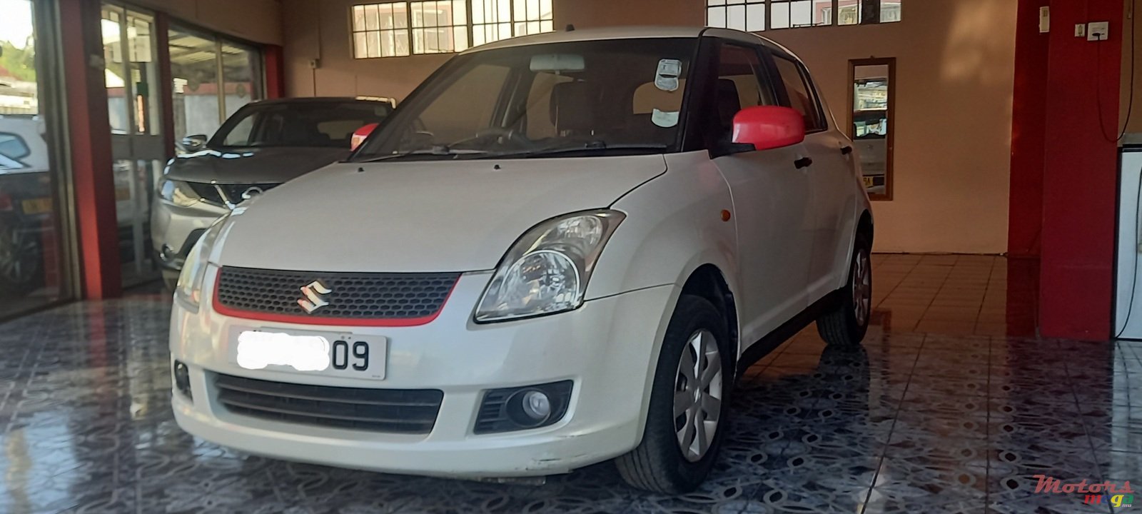 2009' Suzuki Swift VXi photo #2