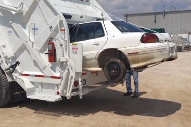 Watch This Garbage Truck Consume a Pontiac Grand Am
