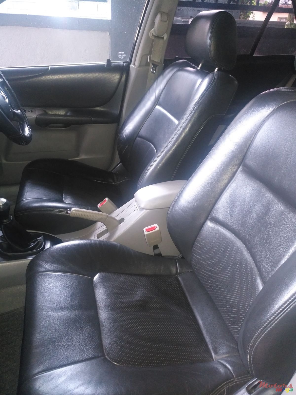 2002' Mazda 323 DELUXE photo #1