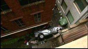 Woman survives 6 floor parking garage plunge