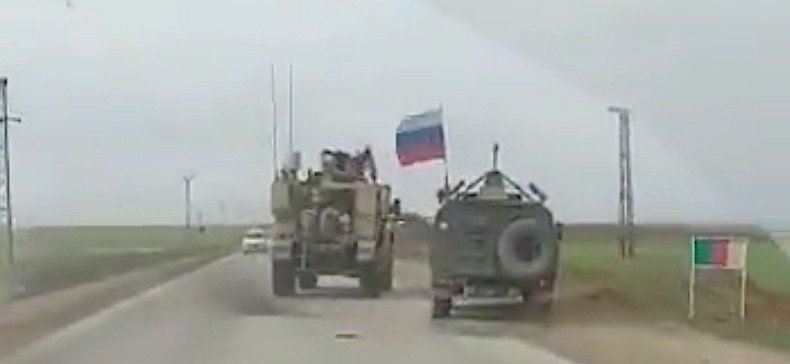 American Armored Truck Pushes Russian Military Vehicle Off the Road in Syria