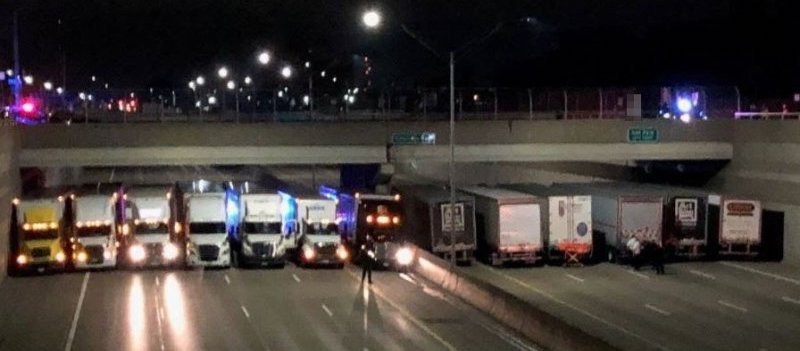 Truckers help troopers prevent man from jumping off Michigan bridge