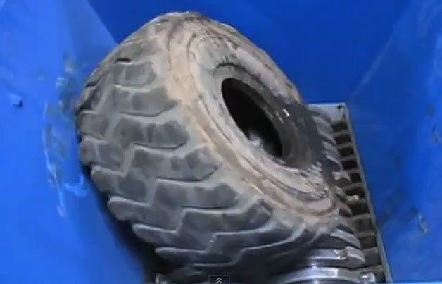 Watch One of the World's Most Powerful Shredders Eat a Six-Foot Tall Truck Tire