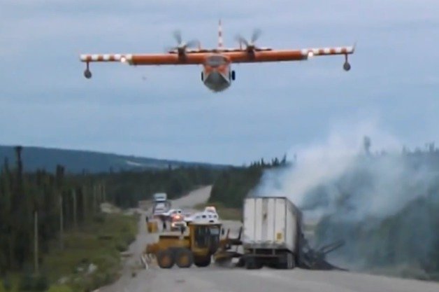 Watch a Water Bomber Plane Drop Its Load On a Truck Fire in Remote Canada