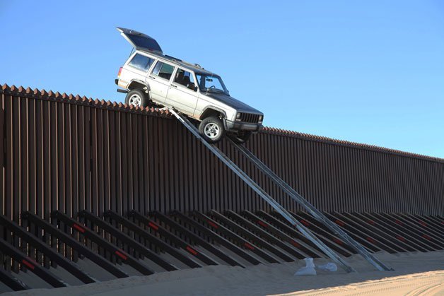 Jeep Cherokee Left Teetering on Border Fence after Failed Crossing Attempt