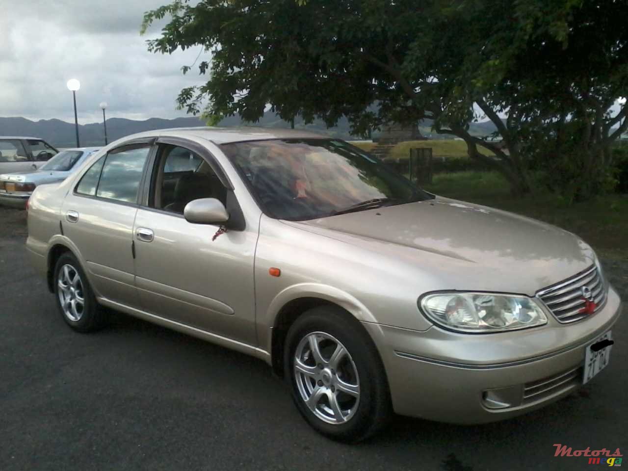 2004' Nissan Sunny photo #1