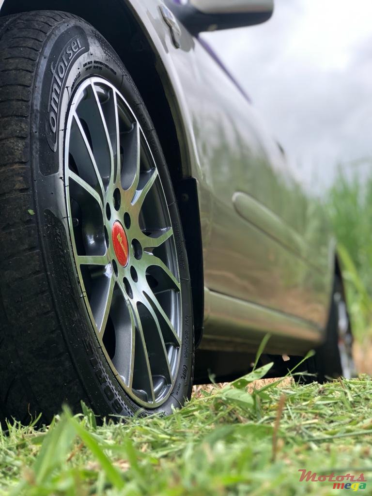 2004' Nissan Sunny photo #1