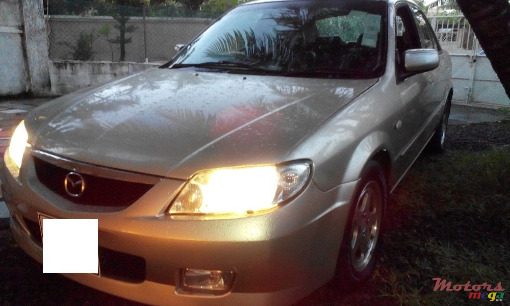 2003' Mazda 323 photo #1