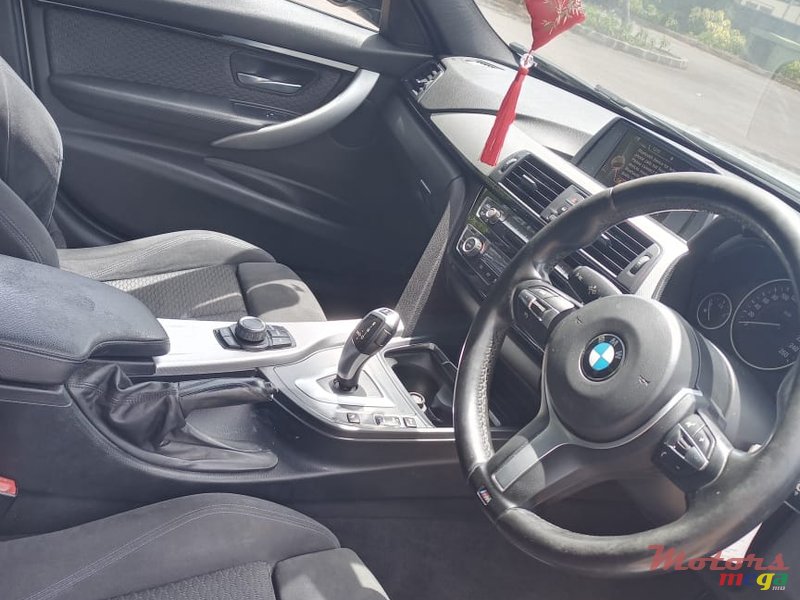 2015' BMW 318 photo #3