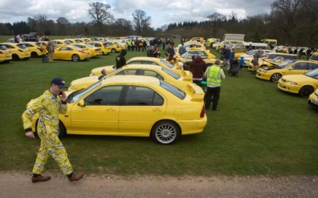 Yellow car owners hold rally in support of pensioner whose 'ugly car' was targeted by vandals for ruining view in Cotswolds village